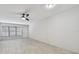 Bright living room with light wood floors and ceiling fan at 4152 55Th N Way # 1028, Kenneth City, FL 33709