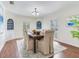 Elegant dining room with hardwood floors and a formal dining table at 4921 Lyford Cay Rd, Tampa, FL 33629