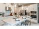 Modern kitchen with white cabinets, stainless steel appliances, and large island at 5107 Slate Hue Pl, Apollo Beach, FL 33572