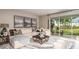Spacious living room with large sliding glass doors leading to backyard at 5107 Slate Hue Pl, Apollo Beach, FL 33572