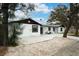 Modern home with white exterior and black accents at 530 Locklie St, Dunedin, FL 34698