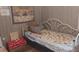 Small bedroom with twin-size bed and dog-themed bedding at 5748 Montana Ave, New Port Richey, FL 34652