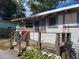 House exterior with a porch and landscaping at 5748 Montana Ave, New Port Richey, FL 34652