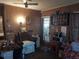 Living room with a recliner, microwave, and entryway at 5748 Montana Ave, New Port Richey, FL 34652