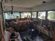 Screened porch with a workbench and tools at 5748 Montana Ave, New Port Richey, FL 34652