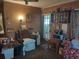 Living room with a recliner, microwave, and entryway at 5748 Montana Ave, New Port Richey, FL 34652