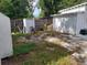 Backyard with sheds and a partially visible house at 5748 Montana Ave, New Port Richey, FL 34652
