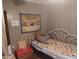 Small bedroom with twin-size bed and dog-themed bedding at 5748 Montana Ave, New Port Richey, FL 34652