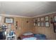 Cozy bedroom with wood paneling and framed artwork at 5748 Montana Ave, New Port Richey, FL 34652