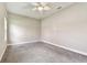 Neutral-toned bedroom with soft carpeting, a ceiling fan, and TV hookups for personalized entertainment at 6317 Brevada Ln, Apollo Beach, FL 33572