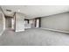 Large bonus room with gray carpet, neutral paint, and high ceilings is ready for your personal touch at 6317 Brevada Ln, Apollo Beach, FL 33572