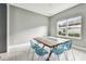 Dining room with modern table with clear chairs, tile flooring, and window at 6317 Brevada Ln, Apollo Beach, FL 33572