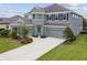 Charming two-story home featuring a well-maintained lawn and a spacious two-car garage at 6317 Brevada Ln, Apollo Beach, FL 33572