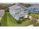 Charming home with manicured lawn, shutters, and a blend of traditional and modern architectural elements at 6317 Brevada Ln, Apollo Beach, FL 33572