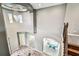 Soaring foyer showcasing hardwood staircase, chandelier and views of the dining and living spaces at 6317 Brevada Ln, Apollo Beach, FL 33572