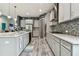 Open kitchen featuring stainless steel appliances, ample cabinetry, and stylish backsplash at 6317 Brevada Ln, Apollo Beach, FL 33572