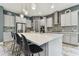 Spacious kitchen island with stainless steel appliances, pendant lighting, and stylish countertops at 6317 Brevada Ln, Apollo Beach, FL 33572