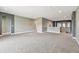 Large, open loft area with neutral carpet, gray walls, and an open view to the lower level at 6317 Brevada Ln, Apollo Beach, FL 33572