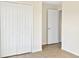 Bedroom with double door closet and tile flooring at 7231 Somerset Pond Dr, Ruskin, FL 33573