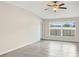 Living room with ceiling fan and a large window at 7231 Somerset Pond Dr, Ruskin, FL 33573