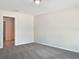 Simple bedroom with carpet and access to bathroom at 7231 Somerset Pond Dr, Ruskin, FL 33573