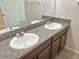 Double vanity bathroom with granite countertop and modern sinks at 7231 Somerset Pond Dr, Ruskin, FL 33573
