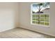 Empty bedroom with tile flooring and a large window at 7231 Somerset Pond Dr, Ruskin, FL 33573