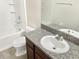 Clean bathroom featuring a bathtub, toilet, and granite countertop at 7231 Somerset Pond Dr, Ruskin, FL 33573