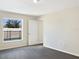 Bright bedroom with carpet flooring, a window overlooking the pool, and access to a private bathroom at 7231 Somerset Pond Dr, Ruskin, FL 33573