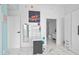 Second bedroom with a desk and view into the bathroom at 777 N Ashley Dr # 2613, Tampa, FL 33602