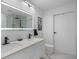 Elegant bathroom with dual sinks and a large mirror at 777 N Ashley Dr # 2613, Tampa, FL 33602