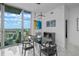 Modern dining room with city view and black and white furniture at 777 N Ashley Dr # 2613, Tampa, FL 33602