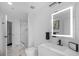 Clean bathroom with illuminated mirror and walk-in shower at 777 N Ashley Dr # 2613, Tampa, FL 33602