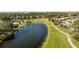 Aerial view of the community, showing homes, landscaping, and a golf course at 847 Ruddy Quail Pl, Sun City Center, FL 33573