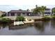 Private dock with steps leading to the canal at 9830 San Sierra Way, Port Richey, FL 34668
