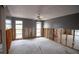 A living room undergoing renovation, showing exposed walls and flooring at 9830 San Sierra Way, Port Richey, FL 34668