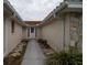 Front entry with walkway leading to the front door at 9830 San Sierra Way, Port Richey, FL 34668