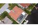 Aerial view of canal-front home with pool and dock at 9830 San Sierra Way, Port Richey, FL 34668