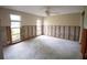 Bedroom ready for renovation, featuring new windows and exposed framing at 9830 San Sierra Way, Port Richey, FL 34668