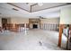 Living room with a fireplace, currently under renovation at 9830 San Sierra Way, Port Richey, FL 34668