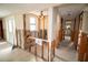 Hallway undergoing renovation with exposed walls and new flooring at 9830 San Sierra Way, Port Richey, FL 34668