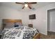 Bedroom with a queen bed, TV mount, and ceiling fan at 10026 Crested Fringe Dr, Riverview, FL 33578