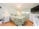 Bright bedroom with a queen bed and white furniture at 10036 63Rd N Ave # 23, St Petersburg, FL 33708
