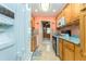 Kitchen with wood cabinets, teal countertops, and gas stove at 10036 63Rd N Ave # 23, St Petersburg, FL 33708