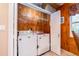 Laundry room with washer, dryer, and wood paneled walls at 10036 63Rd N Ave # 23, St Petersburg, FL 33708