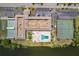 Aerial view showcasing community amenities including tennis courts and pool at 10036 63Rd N Ave # 23, St Petersburg, FL 33708