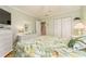 Bedroom with queen-size bed and ample closet space at 10036 63Rd N Ave # 23, St Petersburg, FL 33708