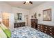 Bright bedroom with en-suite bathroom and ample dresser space at 212 Shell Creek Ct, Apollo Beach, FL 33572