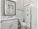 Modern bathroom with white subway tile, shower, and vanity at 2218 6Th E St, Palmetto, FL 34221