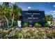 Community entrance with landscaping and signage at 3018 59Th S St # 209, Gulfport, FL 33707